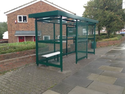 Anti-vandal Kent bus shelter with steel frame and steel mesh walls, with seating.