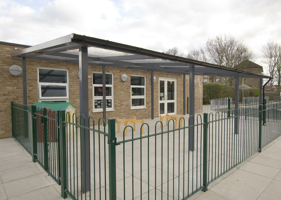 Image of a black shelter store walkway canopy installed at a school